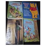Lot of 4 Disney collectibles books, VHS and