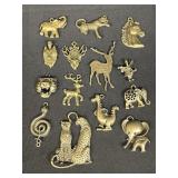 Group of cast metal pendants with brass tone