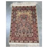 Signed Turkish and silk rug depicting floral