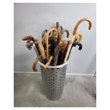Bundle of vintage canes and umbrellas