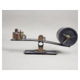 Balancing time kinetic desk clock