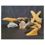 Carved wood whale sculptures