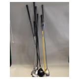 Group of 8 golf clubs