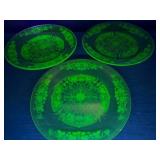 Three vintage uranium glass dinner plates