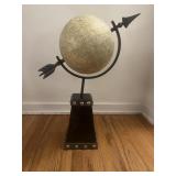 Faux globe mounted on metal base