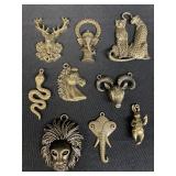 Group of cast metal pendants with brass tone