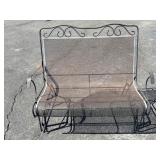 Cast iron swinging patio bench