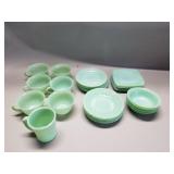 Group of Fire King Jadite cups and saucers and