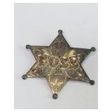 Sterling silver and 10k gold six pointed star