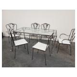 Iron patio dining set with glass-top table