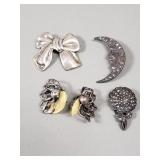 Group of sterling silver earrings and brooches