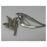 Pair of sterling silver brooches