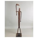 Vintage iron sculpture of man with tool