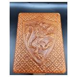 Vintage embossed leather jewelry box featuring a