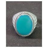 Sterling silver with green glass center stine