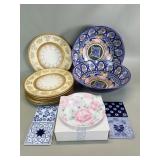 Group of plates, saucers, serving bowls, and