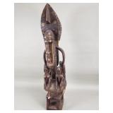 African carved wood Dogon sculpture adorned