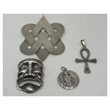 Group of sterling pendants and brooch
