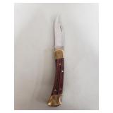 Buck 110 Folding hunter knife with leather sheath