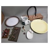 Group of pottery plates, hand bag, pitcher, etc.