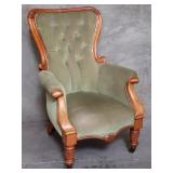 Victorian upholstered walnut arm chair on casters