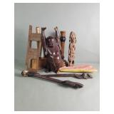 Group of carved wood, figurine, hammer, candle