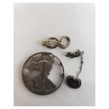 Silver pin, pendant, and scrap.