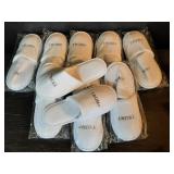8 pairs of Trump white slippers in packaging