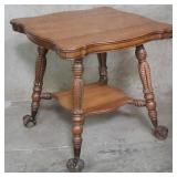 Antique tiger oak parlor table with claw and