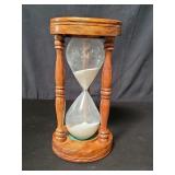 Walnut and glass hourglass