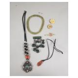 Vintage necklaces, brooch, and tie clip