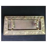 Vintage brass pen tray with embossed satyr face