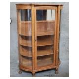 Antique tiger oak curio cabinet with curved glass