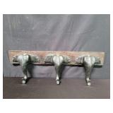 Carved wood wall rack depicting three elephants