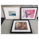 Three framed photographs