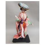 Vintage Japanese geisha doll on wood stand