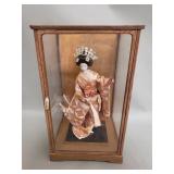 Vintage Japanese geisha doll in display case