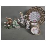 Group of porcelain figures, plates, salt cellar,