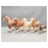 Group of vintage plastic horses and donkey