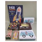 Group of PEZ candy dispensers and metal sign