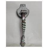 Vintage brass door thumb latch with a twisted