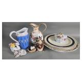 Group of porcelain pitcher, cream, figures,