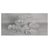 Group of cut crystal bowls, vases, and lidded box