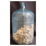 Vintage 5-gallon glass water jug with wine