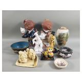 Group of Japanese and Chinese pottery figures,
