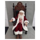 Large vintage Santa Clause doll sitting on wood