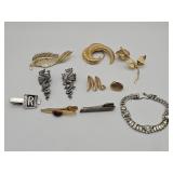 Vintage designer jewelry brooches, tie clips,