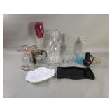 Group of glass coin banks, pitcher, inkwell, etc.