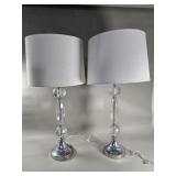 Pair of faceted glass and chrome-colored table