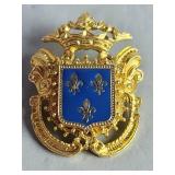 Gold tone fleur-de-lis brooch